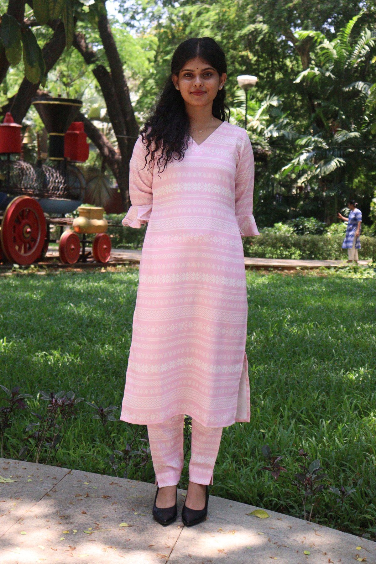 Blush pink woven kurta set with V-neck, fluted sleeves and matching pants