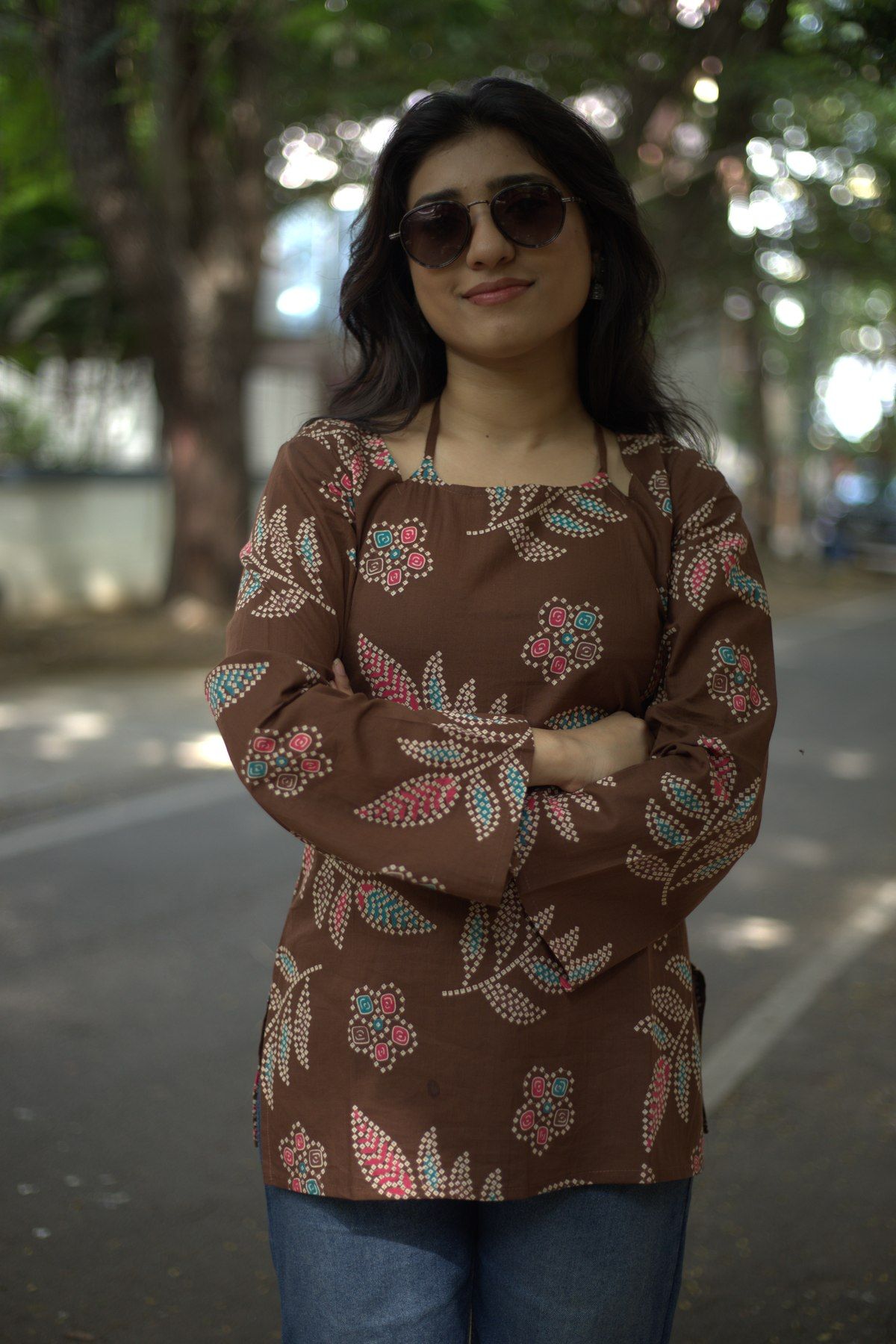 Closer view of the cocoa sprig top showing the dotted leaf print and square neckline
